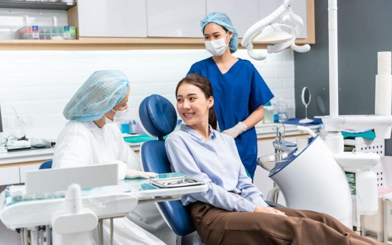 Patient Consulting Dentist and Dental Assistant